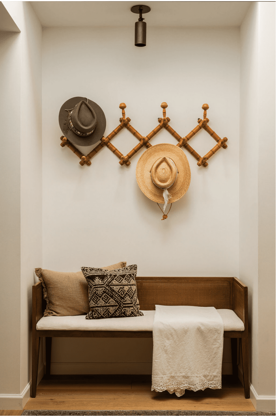 Entryway seating area hats on the wall